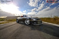 Wallpapers with ergonomic car Honda S2000 against the blue cloudy sky